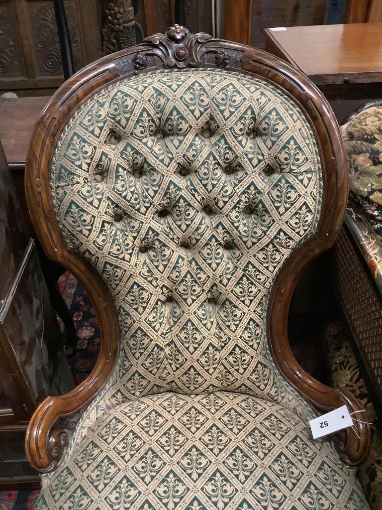 A Victorian carved walnut spoonback nursing chair